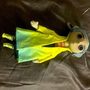 New but out of box Coraline doll. She looks a little bent from sitting so long.